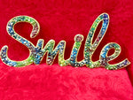 Wooden smile with alcohol ink and resin